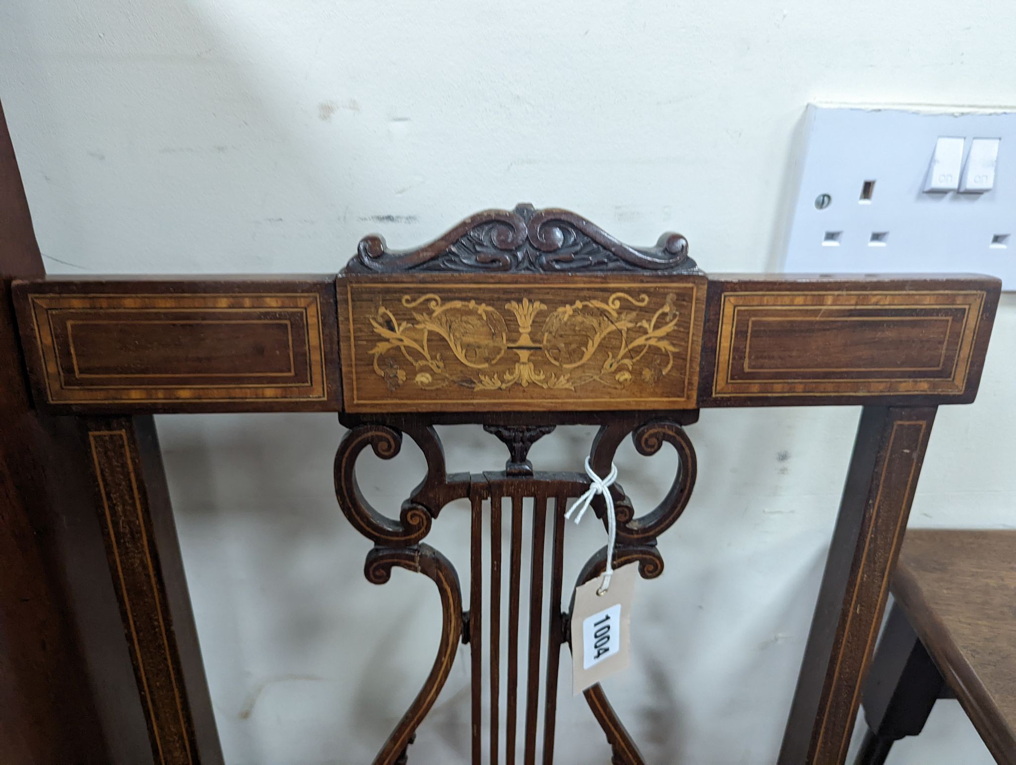 A pair of Edwardian inlaid mahogany lyre back chairs
